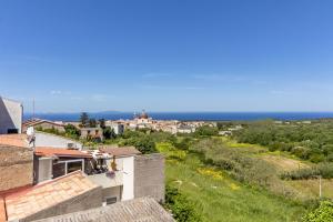 a view of the ocean from the roof of a house at NURAS - Affittacamere L'Azzurra - Double bedrooms private bathroom and seaview solarium in Sorso