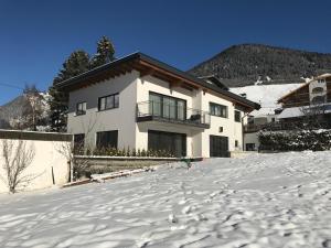 a house in the snow in front at Haus "Charly" in Nauders
