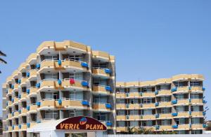 a tall apartment building with a sign in front of it at BLUESEA Veril Playa in Playa del Ingles +38 photos