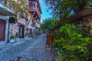 an old cobblestone street in an old town at Harmony Butik Otel in Alanya