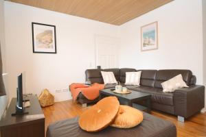 a living room with a couch and a table at Apartments in Ebrach am Kloster in Ebrach