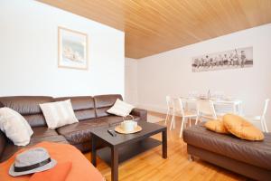 a living room with a couch and a table at Apartments in Ebrach am Kloster in Ebrach +100 photos
