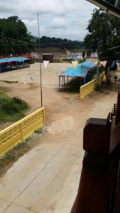 a view of a park with a yellow fence at Welcome holiday in Chiang Khan