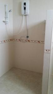 a small bathroom with a shower and a tub at Welcome holiday in Chiang Khan