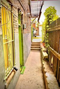 an empty alley with a building and a fence at Chicago Coach Casa in Chicago +15 photos