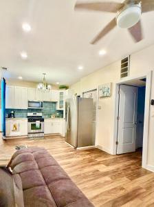 a kitchen with a couch and a refrigerator at Chicago Coach Casa in Chicago