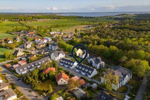 an aerial view of a small town with a large circle at Usedom-Idyll in Loddin