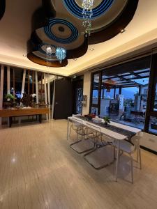 a room with tables and chairs in a building at Love's World B&B in Ji'an