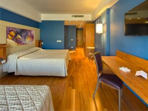 Postel nebo postele na pokoji v ubytování Catania International Airport Hotel