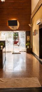 a living room with a television and a lobby at Hotel Embassy Star Taaj Agra - Budget Ac Rooms Near Taj in Agra