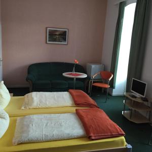 Ένα ή περισσότερα κρεβάτια σε δωμάτιο στο Pension Gutshaus