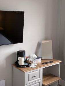 a table with a coffee maker on top of it at Balreask Bar, Restaurant & Guest Accommodation in Navan