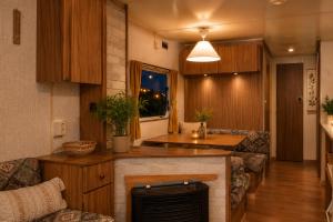 a living room with a kitchen with a counter at Belgian GP 2026 Fast Access The Hilltop Lodge in Amblève