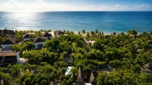 an aerial view of the resort and the ocean at Garden Atelier - Private Cenote & Steps from the Beach in Tulum