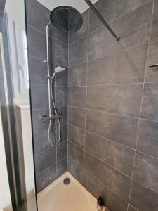 a shower with a shower head in a bathroom at Studio Villa Monica in Vallauris +27 photos