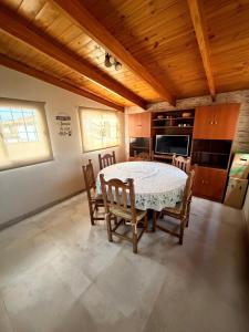 a dining room with a table and some chairs at Mi hogar in Guaymallen