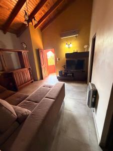 a living room with a couch and a fireplace at Mi hogar in Guaymallen +9 photos