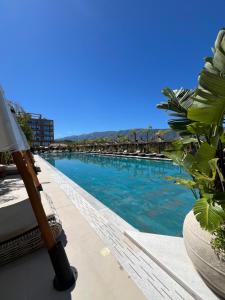 a view of a swimming pool from a balcony at Ciel Apartement in Orikum