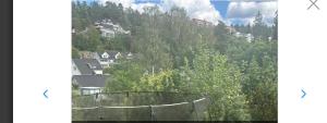 a view of a mountain with houses and trees at Nordstrands Ro in Oslo