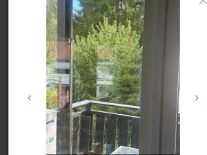a view of a balcony from a window at Nordstrands Ro in Oslo +7 photos