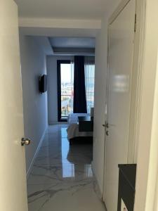 a view of a room with a bed and a window at AsiaHOTEL in Bodrum City