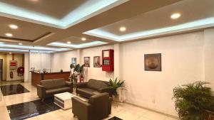 a lobby with a waiting room with couches and aupuncture at Near Jonker Street - JCITYHOTEL - FREE PARKING in Malacca +20 photos