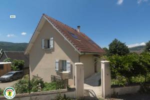 a small house with a fence in front of it at La Matheysiene in La Motte-dʼAveillans