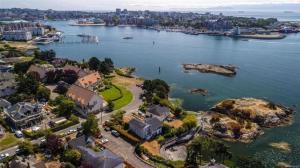 an aerial view of a city and a body of water at ocean view two bedroom suite in Oak Bay