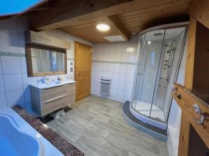 a bathroom with a shower and a sink at Chalet Heidi in Ventron +16 photos