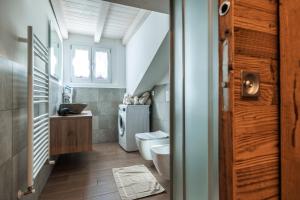 a small bathroom with a toilet and a sink at CHALET LAURA apricacasevacanze in Aprica +22 photos