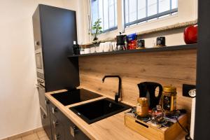 a kitchen with a sink and a counter top at The Other Side in Lainate +10 photos