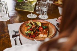 a plate of food on a table with a plate of food at Vila Prezident in Sremski Karlovci