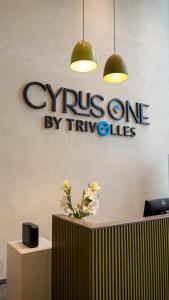 a cyprus one by two sign on a wall at Cyrus One By Trivelles in Islamabad