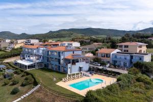 an aerial view of a large house with a swimming pool at Appartamenti Abbaidda 4 in Valledoria