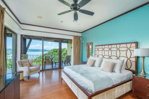 a bedroom with a bed and a balcony at Las Terrazas 7 Peninsula Papagayo in Nacascolo