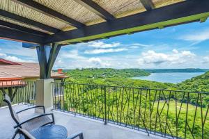 a balcony with a view of a lake at Las Terrazas 7 Peninsula Papagayo in Nacascolo +41 photos