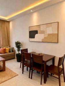 a dining room with a table and chairs at Modern Comfort Stay Tanger in Tangier