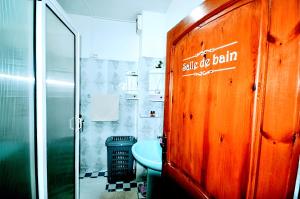 a bathroom with a toilet and a sink and a shower at Vintage apartment EL JADIDA in El Jadida +53 photos