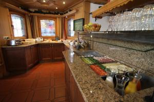 a kitchen with a counter with some food on it at Tirolerhof - inklusive Super Sommer Card in Serfaus