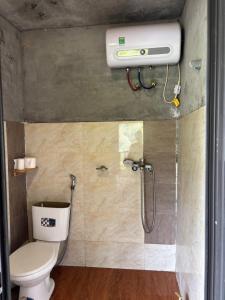 a bathroom with a toilet and a shower at Chacha's House in Sapa