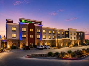a hotel building with cars parked in a parking lot at Holiday Inn Express & Suites Truth or Consequences by IHG - Newly Renovated in Truth or Consequences