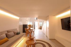 a living room with a couch and a table at Dagaz Suites in Fira