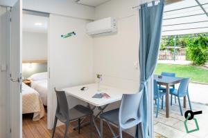 a room with a table and chairs and a bedroom at Hotiday Otranto Porto in Otranto