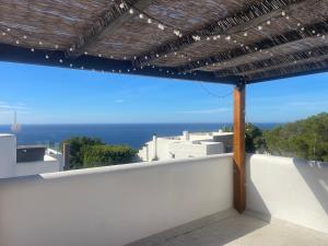 a balcony with a view of the ocean at Casa Bonic -Sunset Seaview in Sant Josep de sa Talaia