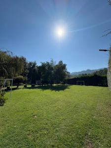 an open field with a soccer ball in a field at Parcela Peumayen Casa 4 in Pucura +5 photos