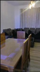 a living room with a table and a couch at Ko Villa in Rivière du Rempart