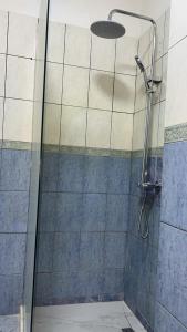 a shower with a glass door in a bathroom at Spacious Coastal Retreat - Golem Beach Near Durrës in Golem +17 photos