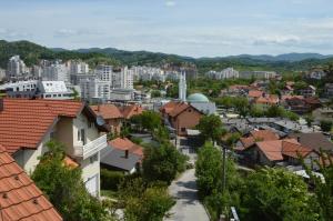 a view of a city with buildings and trees at Apartments Mensa in Tuzla