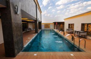 a swimming pool in the middle of a building at Redwaves Hotel in Jeddah