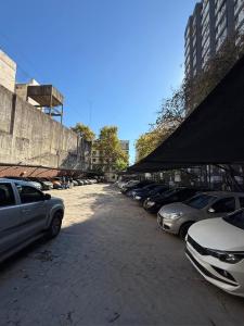 a row of cars parked in a parking lot at Hispano Argentino in Buenos Aires